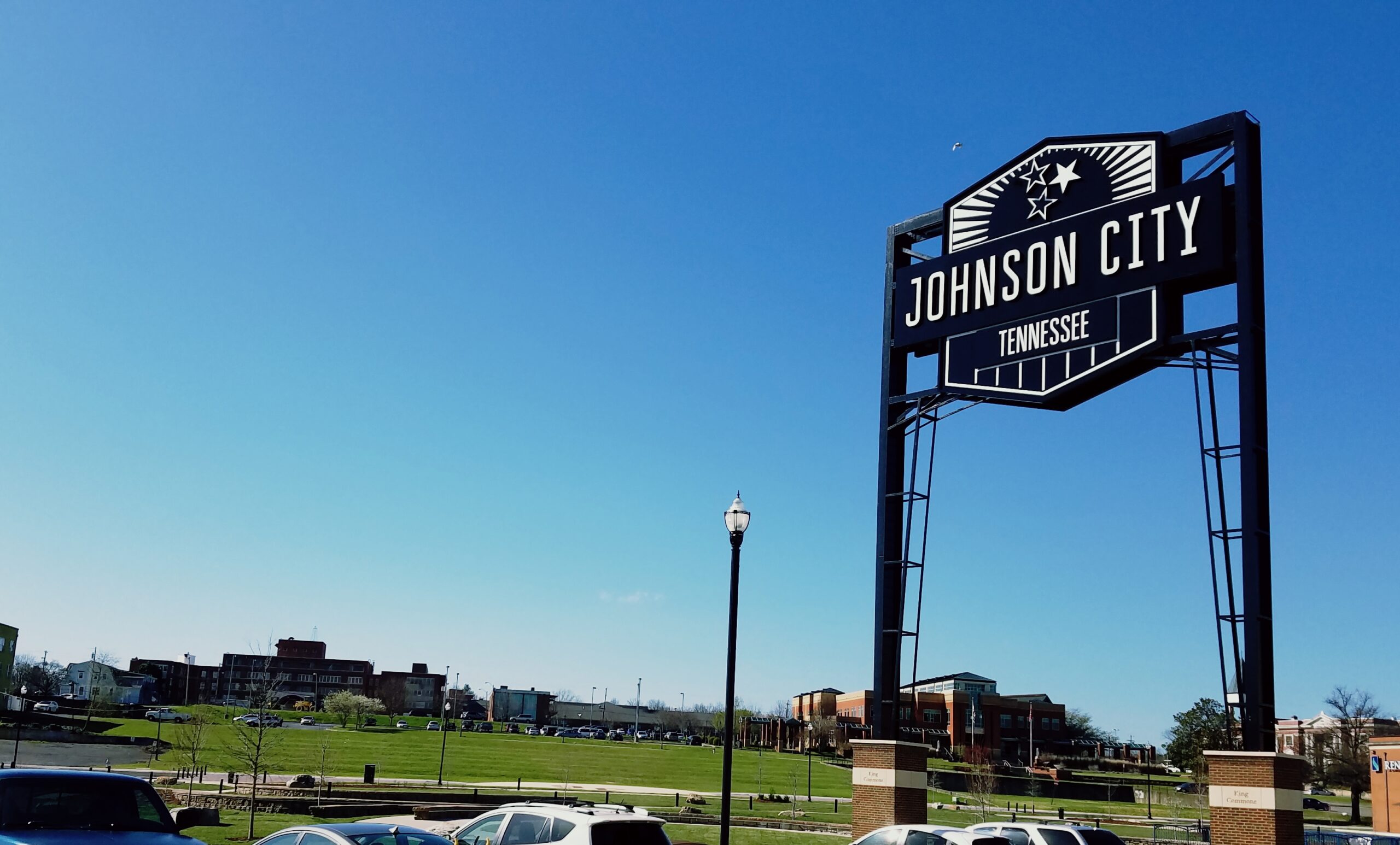 Johnson City Landmark Sign with view of TownView (L) and City Library (R)